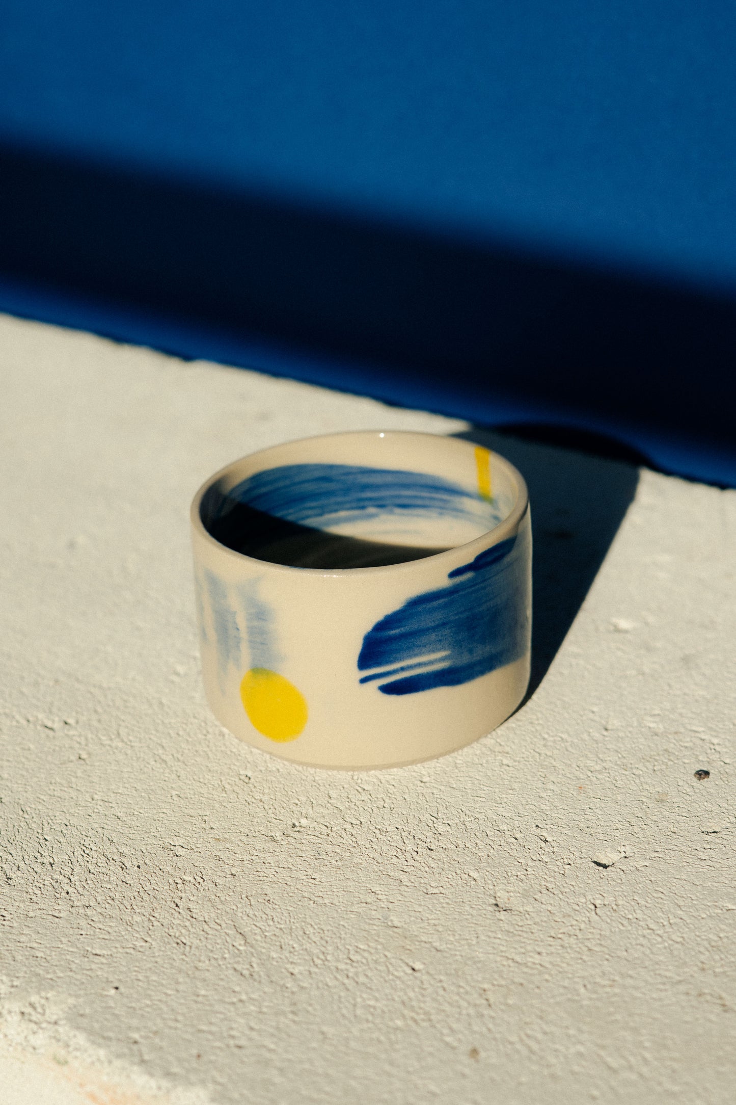 Small blue painted cup