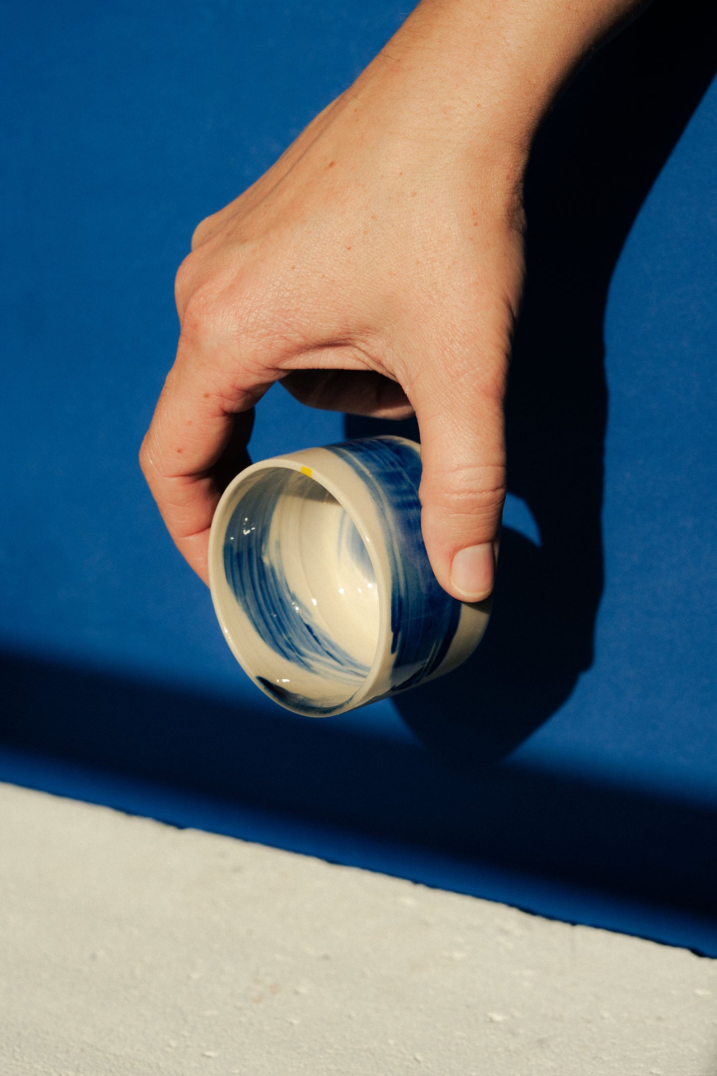 Small blue painted cup
