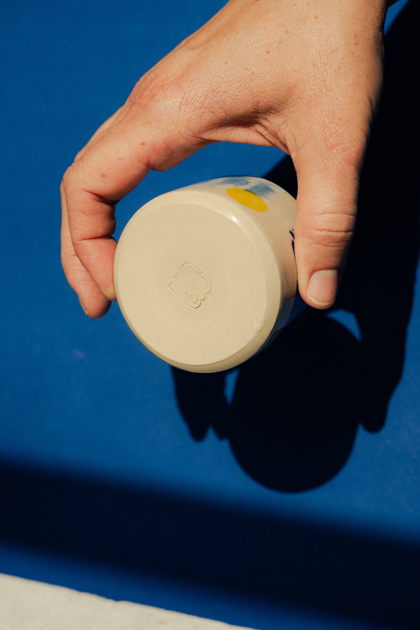 Small blue painted cup