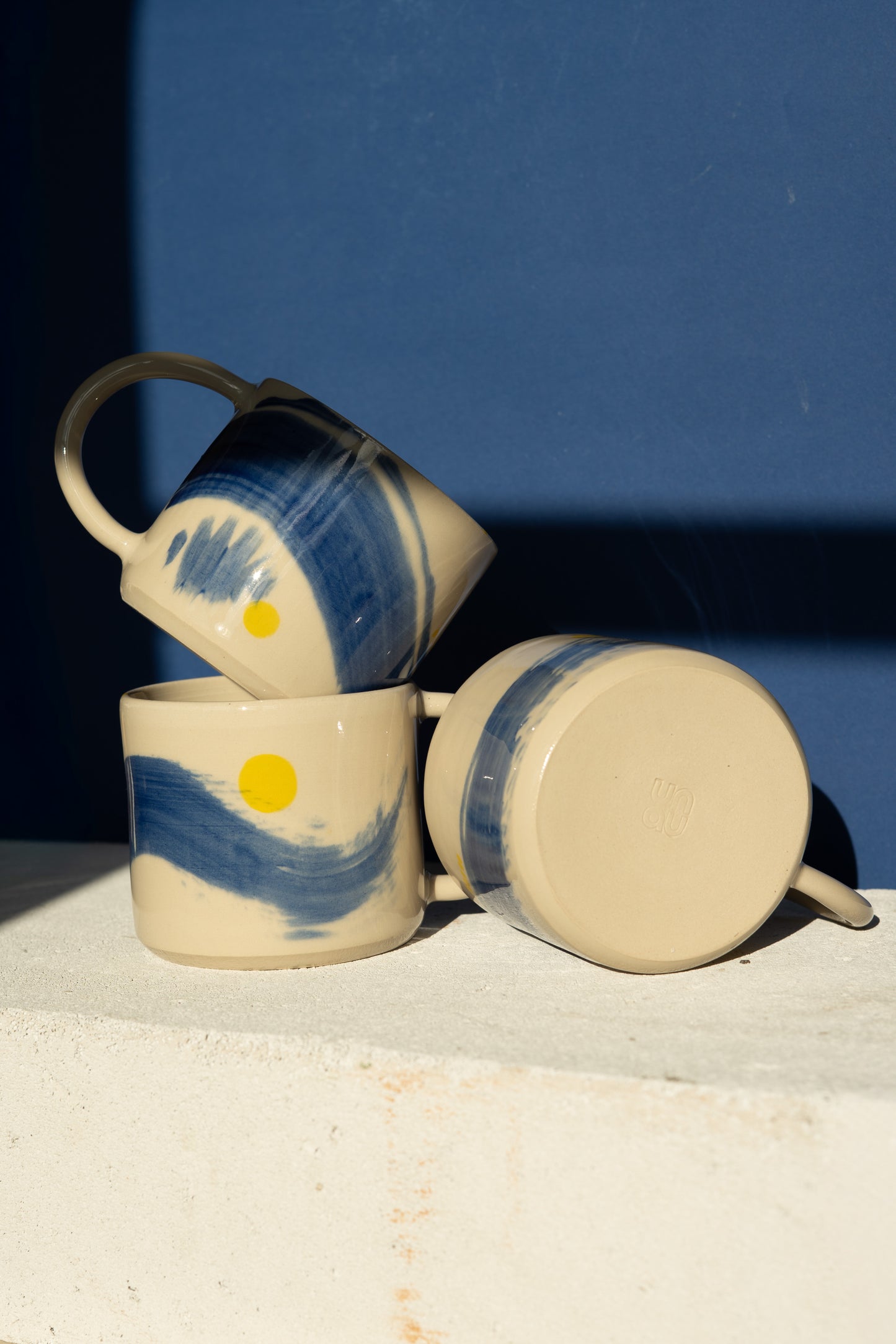 Large mug with blue stripe and yellow details