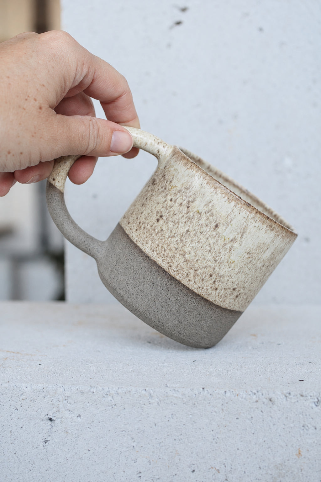Large brown mug with sand glaze